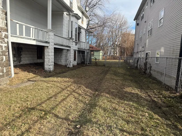 a view of a yard with a house