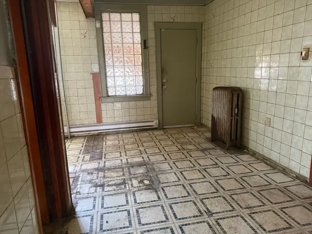 a view of empty room with windows