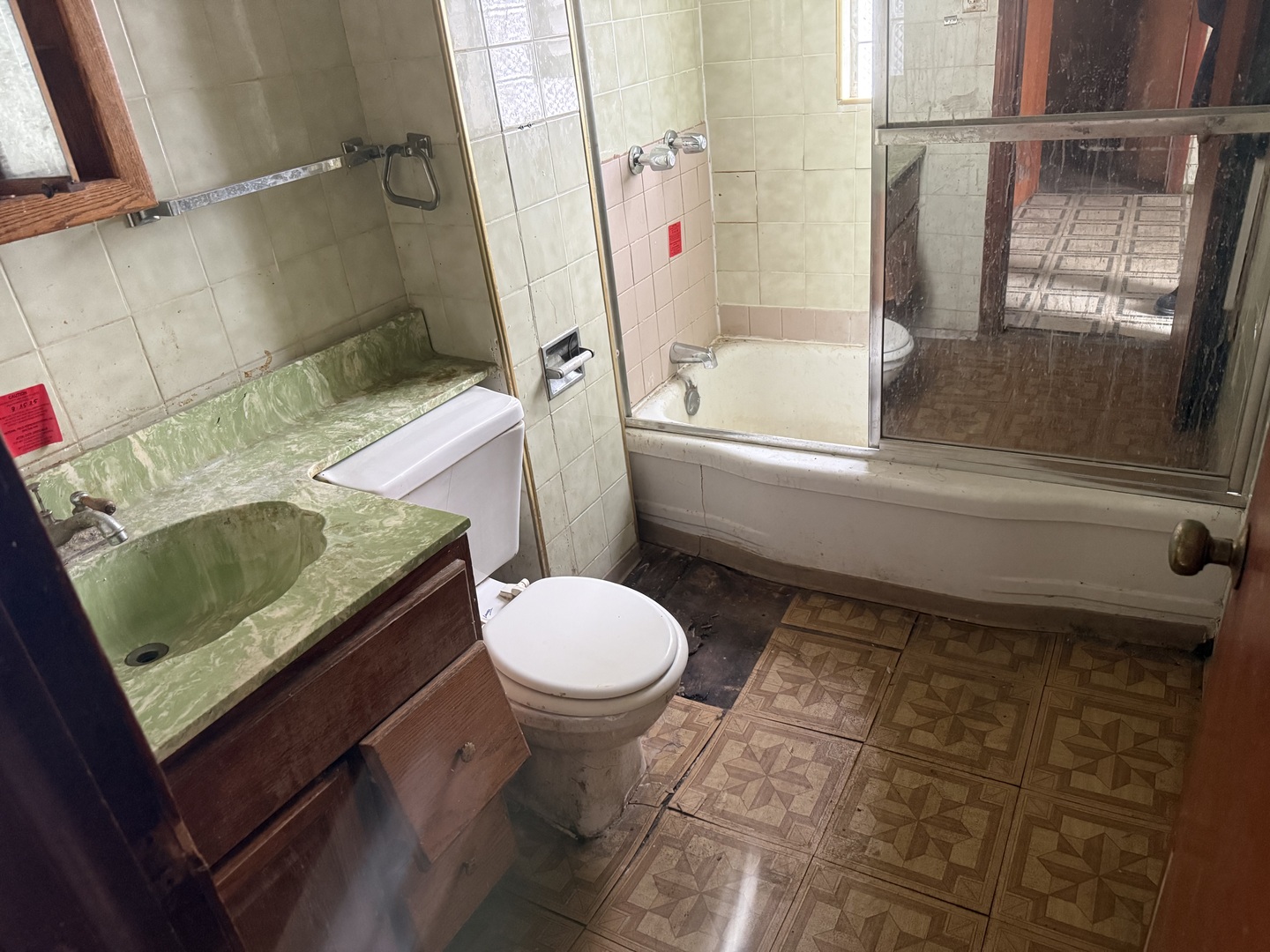 6951 South Princeton Avenue Chicago, IL 60621 - Photo 6 of 25 a bathroom with a sink and toilet