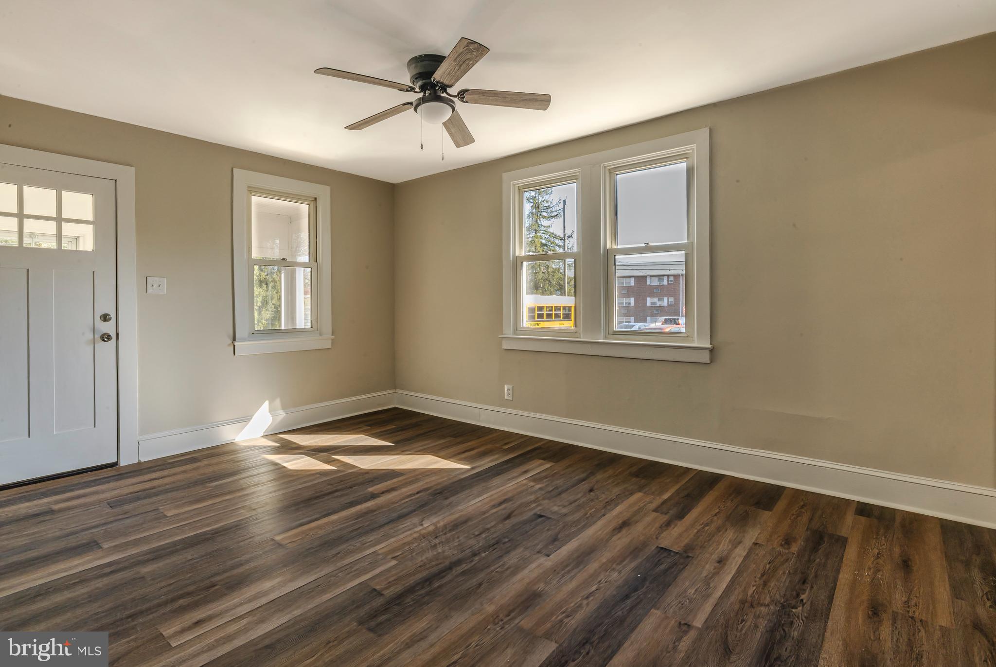 14 Forrest Avenue Clementon, NJ 08021 - Photo 12 of 20 a view of an empty room with wooden floor and a window