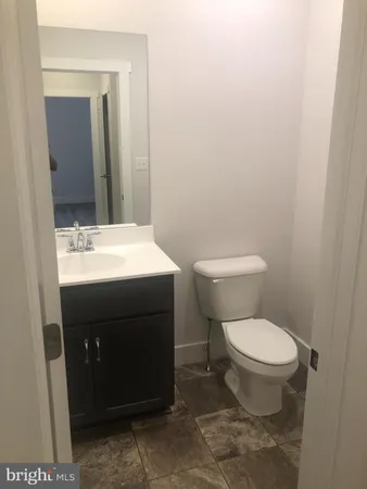 a view of a bathroom from a hallway