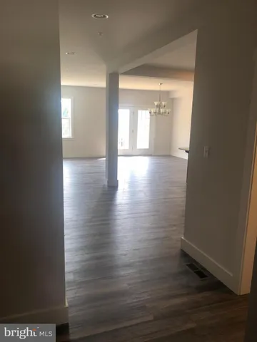 a kitchen with granite countertop a sink a stove and cabinets