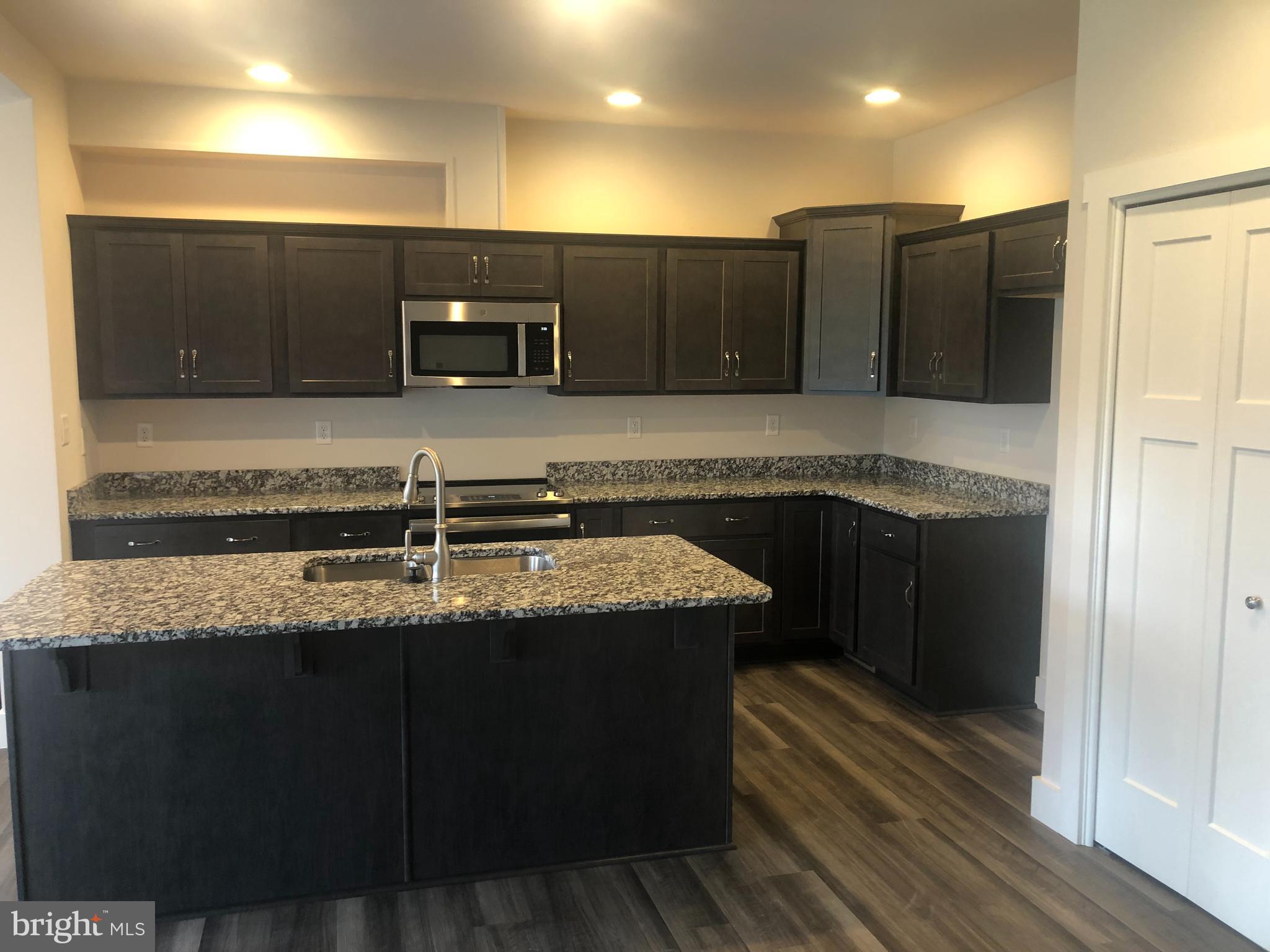 4135 Orrs Town Court, Unit 4B Mechanicsburg, PA 17050 - Photo 16 of 49 a kitchen with a sink and an oven