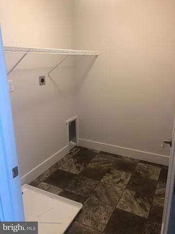 a view of a room that has a bed in it