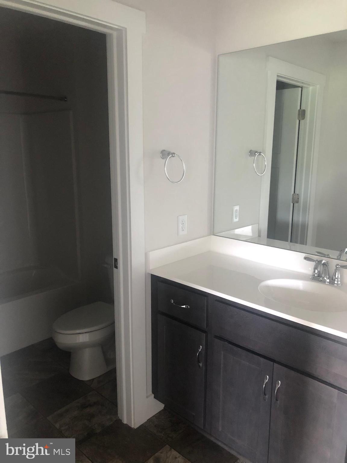 4135 Orrs Town Court, Unit 4B Mechanicsburg, PA 17050 - Photo 28 of 49 a bathroom with a sink and a toilet