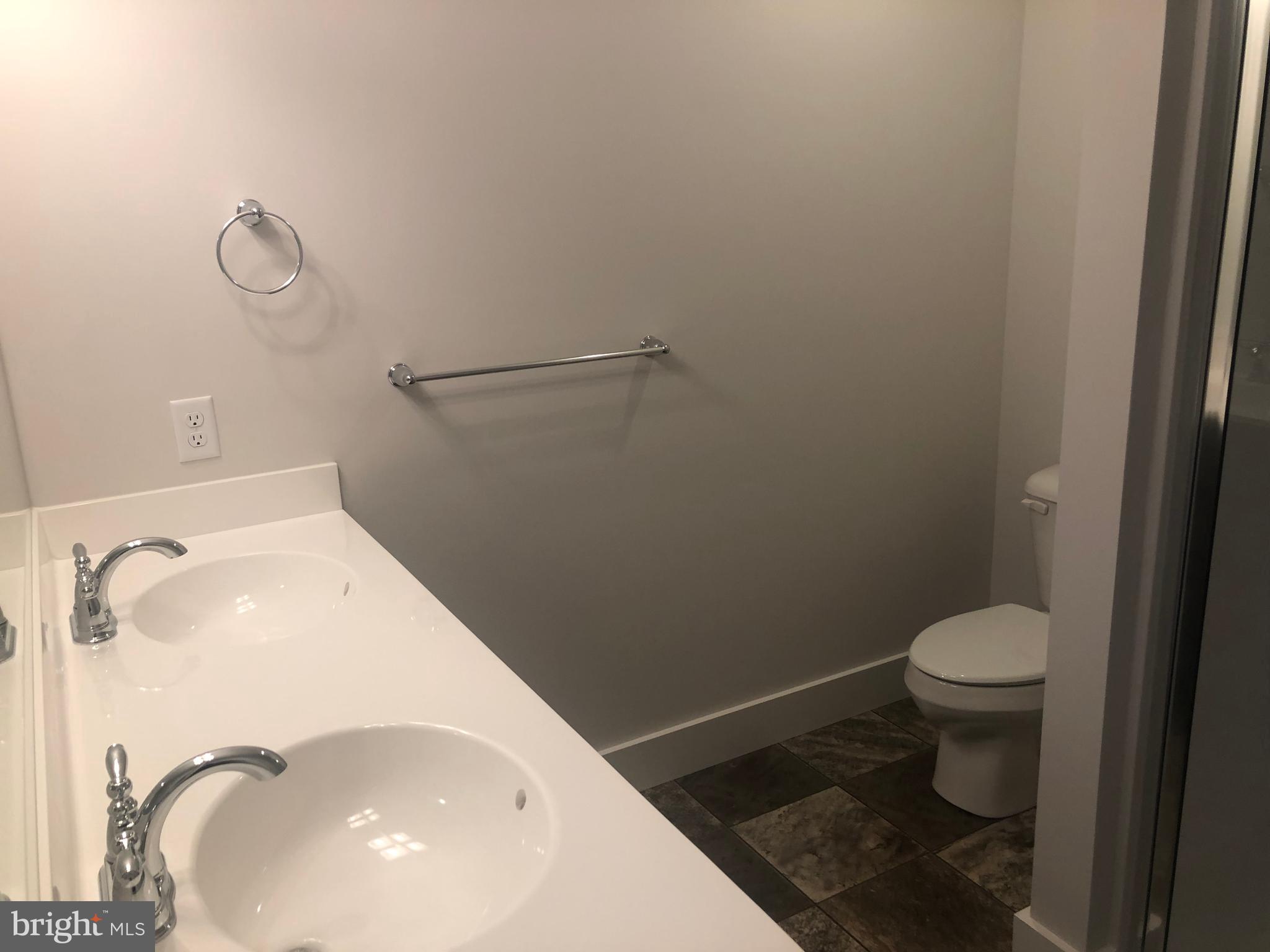 4135 Orrs Town Court, Unit 4B Mechanicsburg, PA 17050 - Photo 42 of 49 a bathroom with a toilet and a sink