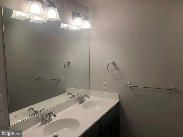 a view of a house next to a yard