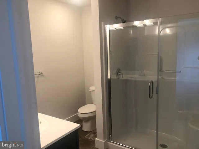 a kitchen with stainless steel appliances granite countertop a refrigerator a sink and a stove