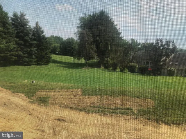 a sign board with a yard