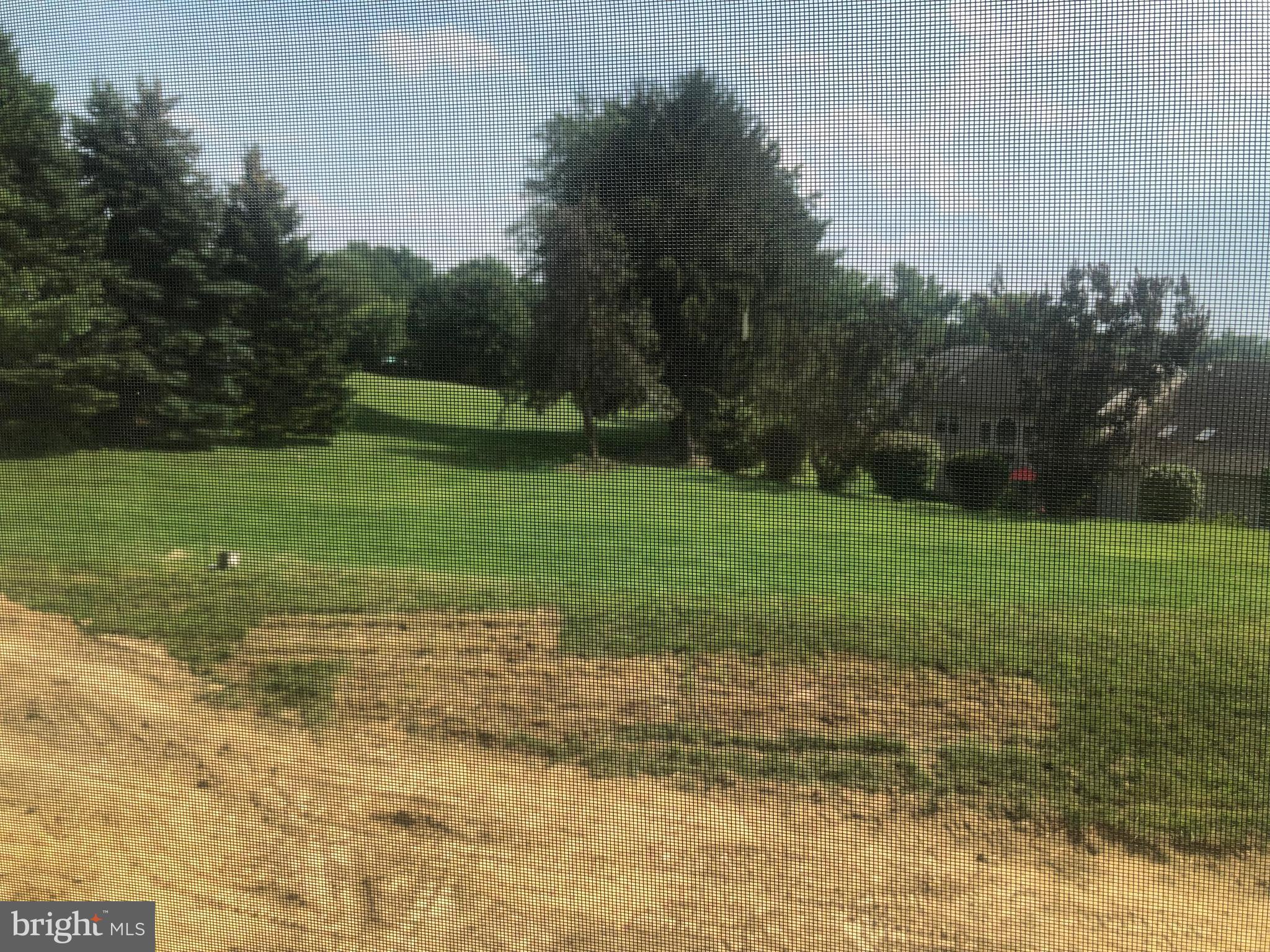 4135 Orrs Town Court, Unit 4B Mechanicsburg, PA 17050 - Photo 45 of 49 a view of a field with trees in background