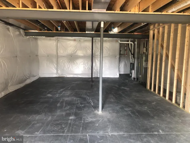 a view of an empty room with a fireplace