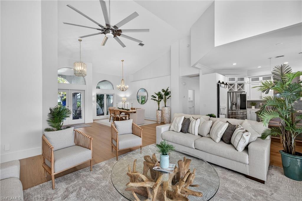 7657 Ponte Verde Way Naples, FL 34109 - Photo 12 of 41 a living room with furniture or chandelier and a couch