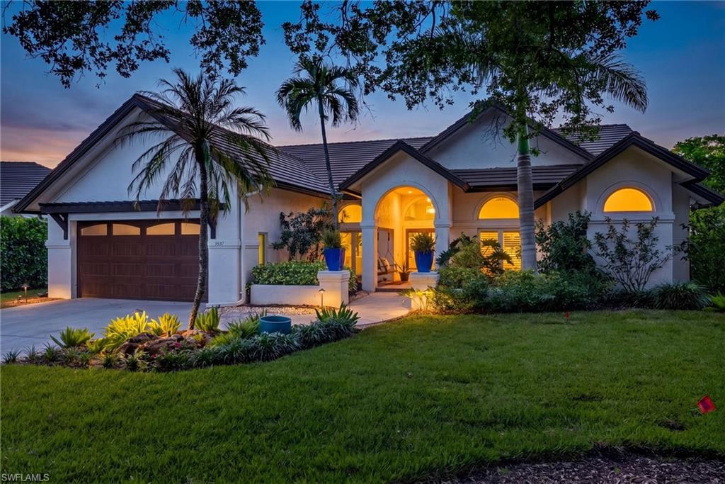7657 Ponte Verde Way Naples, FL 34109 - Photo 2 of 41 a view of a house with a big yard and potted plants