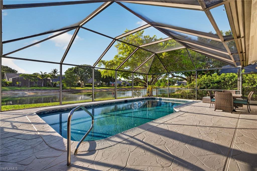7657 Ponte Verde Way Naples, FL 34109 - Photo 34 of 41 a view of swimming pool with a patio