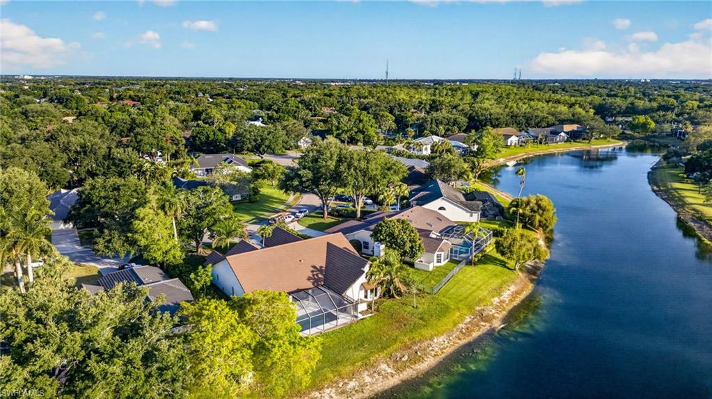 7657 Ponte Verde Way Naples, FL 34109 - Photo 37 of 41 an aerial view of a house with a garden and swimming pool