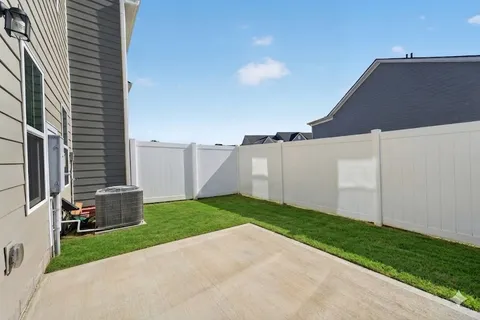 a backyard of a house with lots of green space