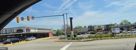 6809 Rolling Road Springfield, VA 22152 - Photo 37 of 50 Vibrant shopping district under blue skies.