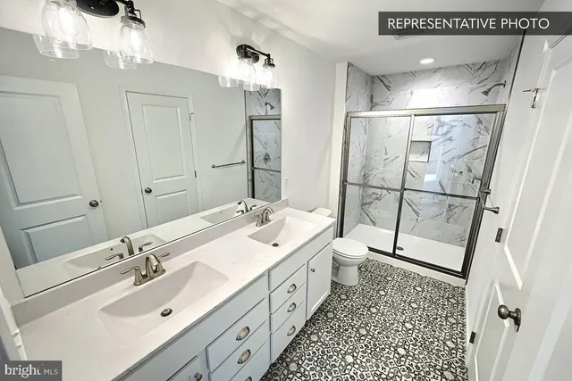 a bathroom with a glass shower door