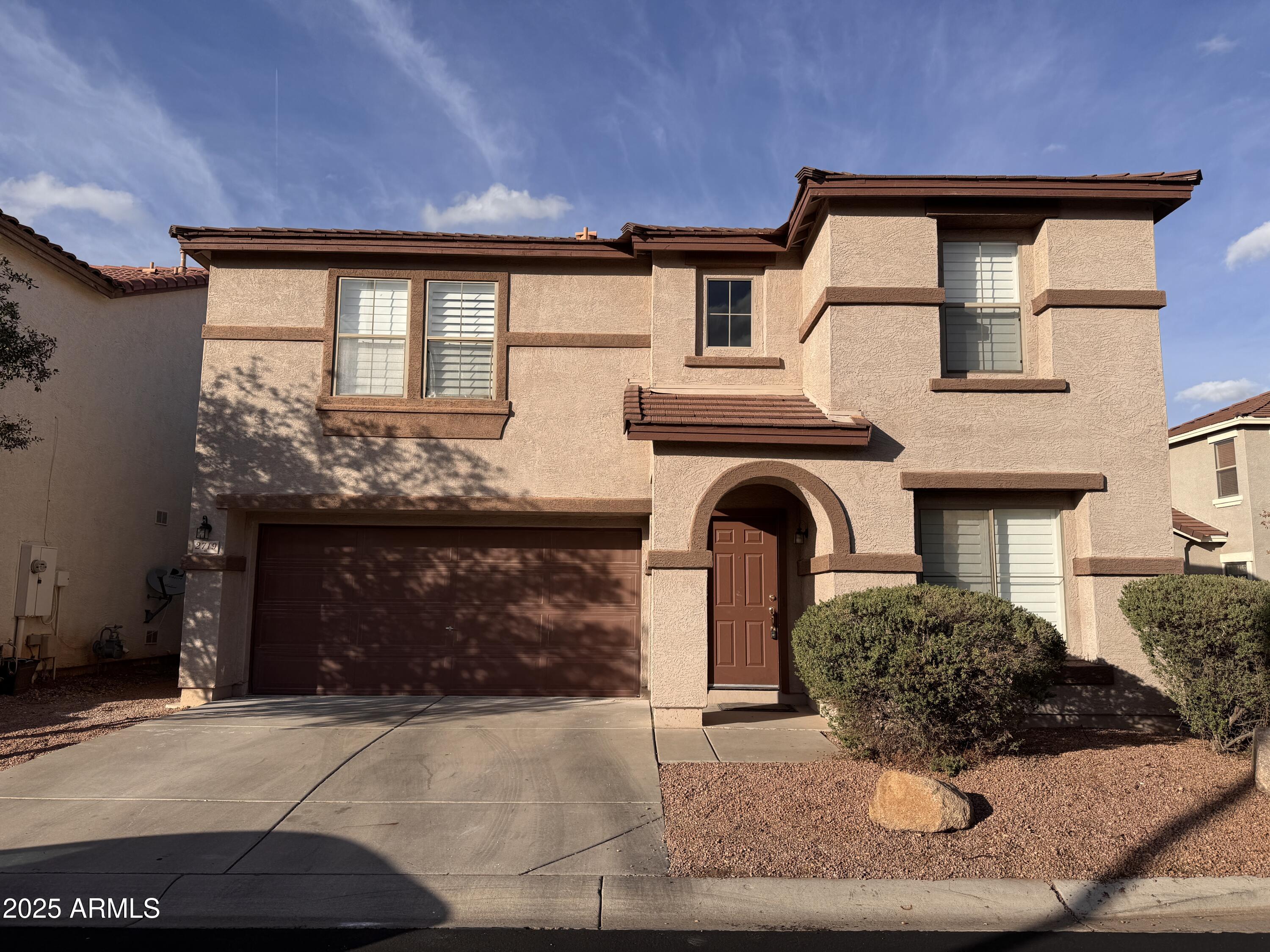 2719 South Sailors Way Gilbert, AZ 85295 - Photo 1 of 14 a front view of a house with garden