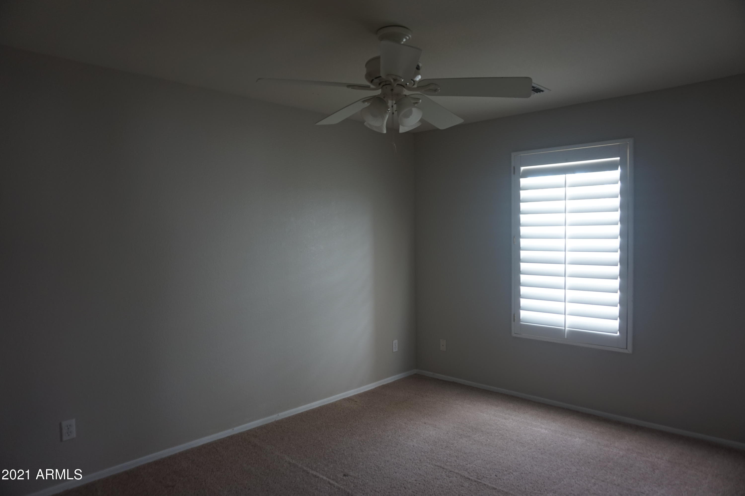 2719 South Sailors Way Gilbert, AZ 85295 - Photo 11 of 14 an empty room with a window