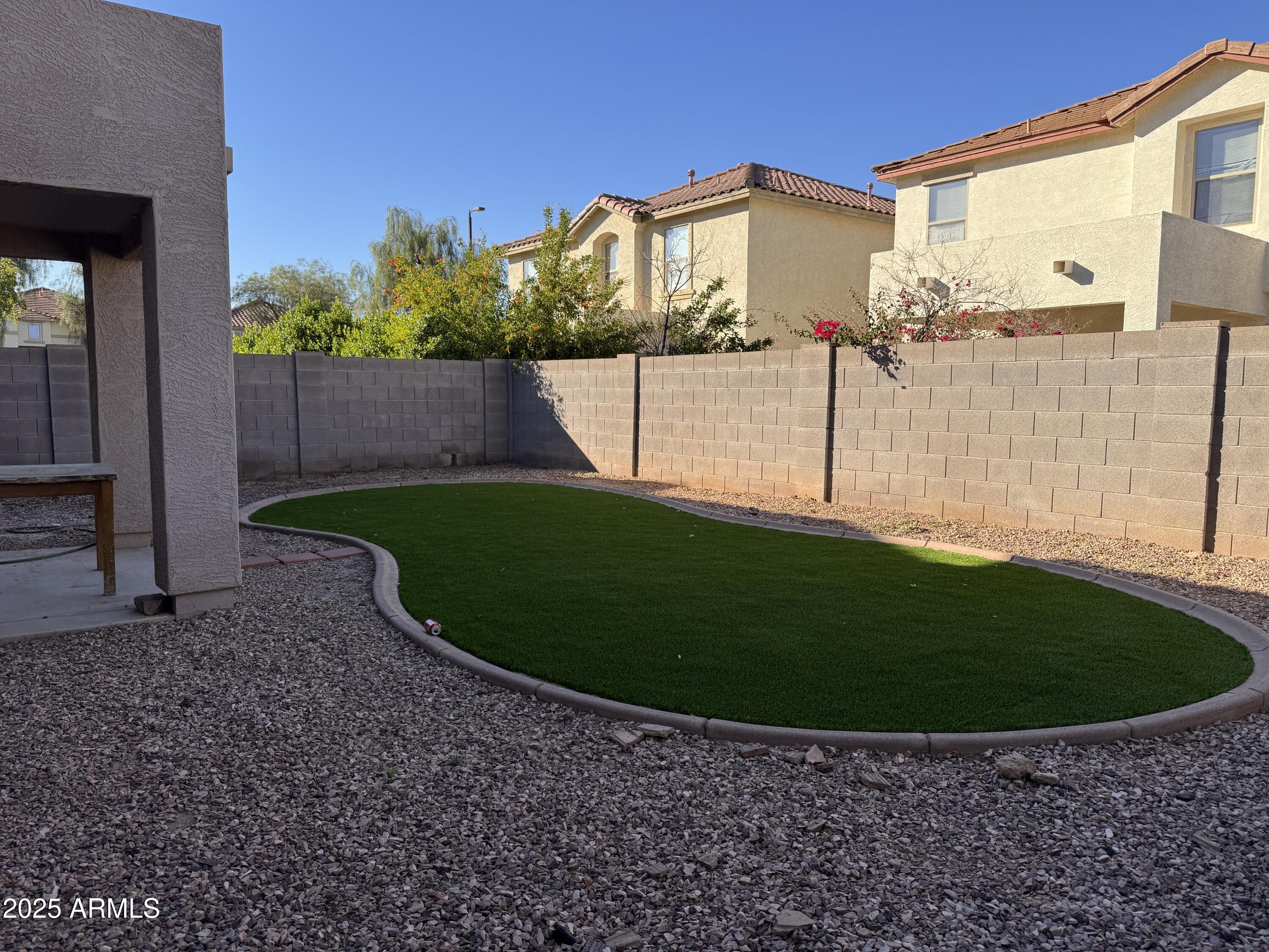 2719 South Sailors Way Gilbert, AZ 85295 - Photo 13 of 14 a view of a house with a backyard