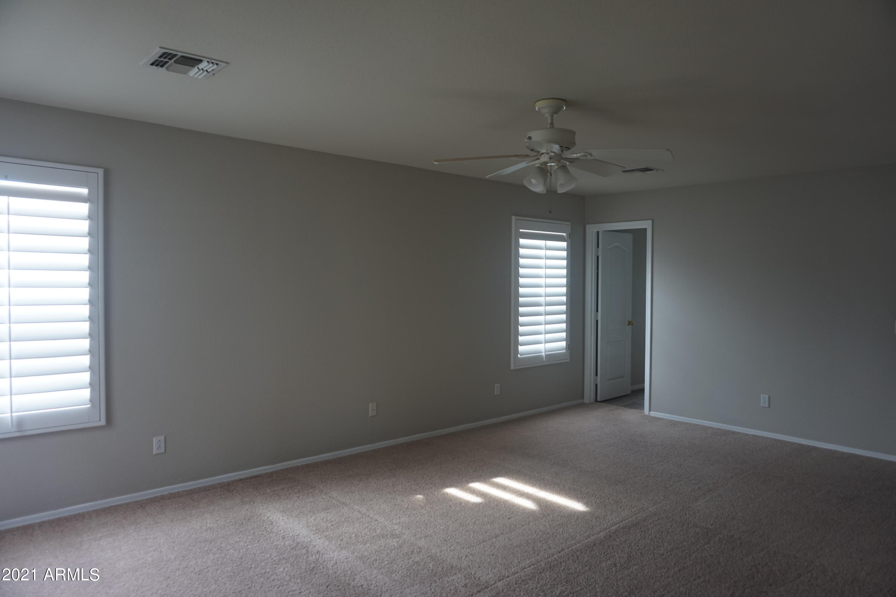 2719 South Sailors Way Gilbert, AZ 85295 - Photo 8 of 14 a view of an empty room with a window