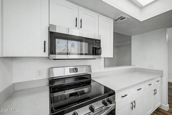 a kitchen with a sink and refrigerator
