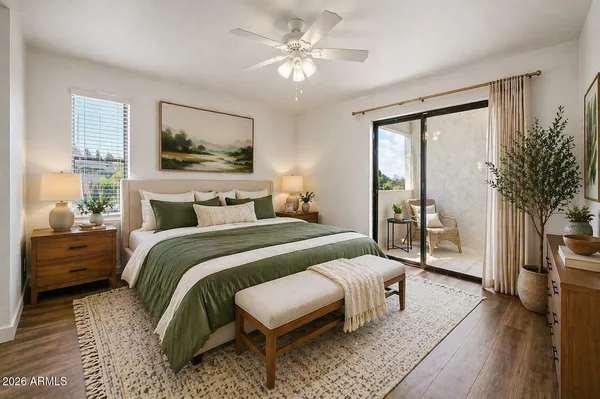 an empty room with wooden floor chandelier fan and windows