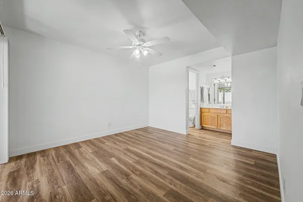 a living room with furniture and a glass door shower
