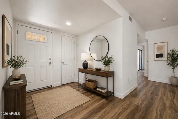 a view of living room and wooden floor