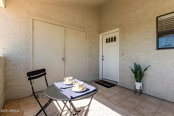 a view of a swimming pool with a patio
