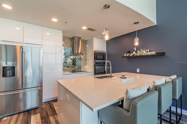 a kitchen with a table and chairs