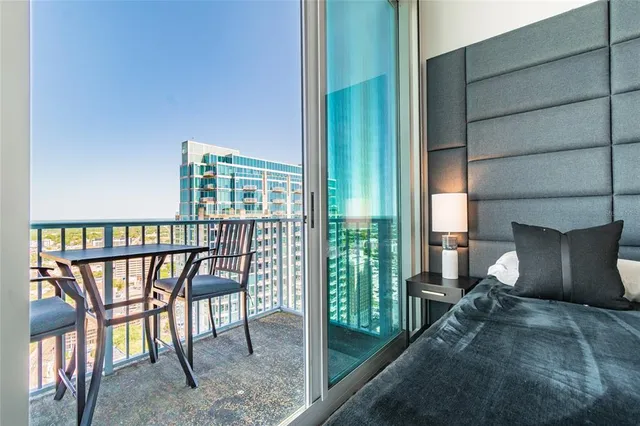 a view of a balcony with furniture