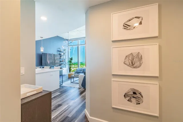 wooden floor with a dining table and chairs