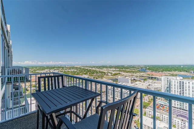 a view of a balcony with an outdoor seating