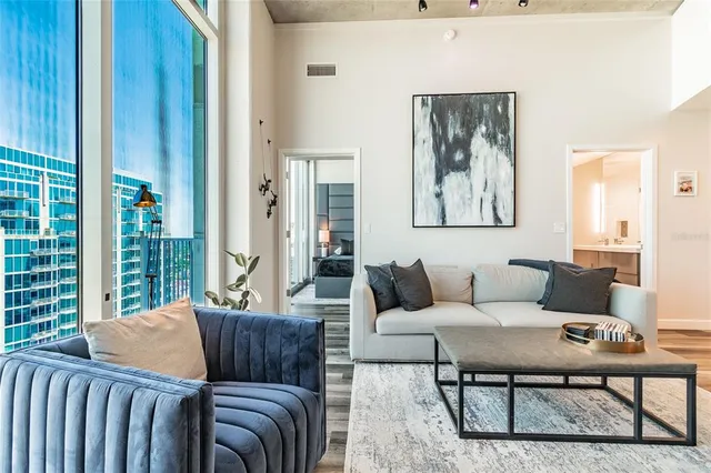 a living room with furniture and a window