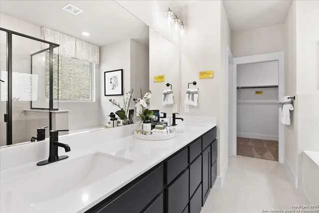 a bathroom with a bathtub and a shower