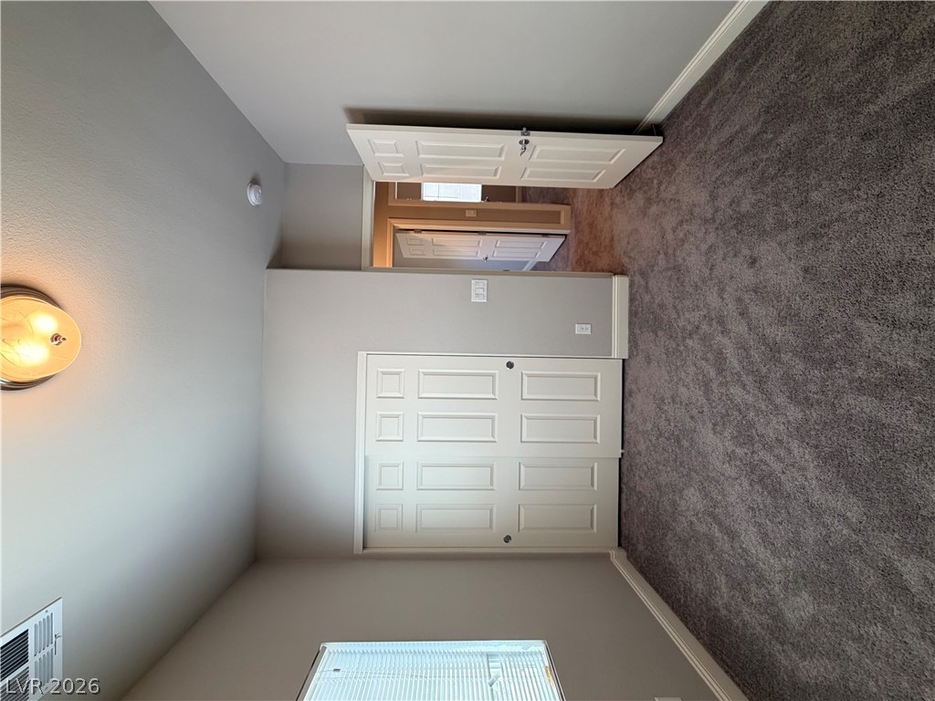 6385 Jackson Spring Road Las Vegas, NV 89118 - Photo 13 of 36 A well-maintained interior offers practical living space with soft carpeting and functional closets.