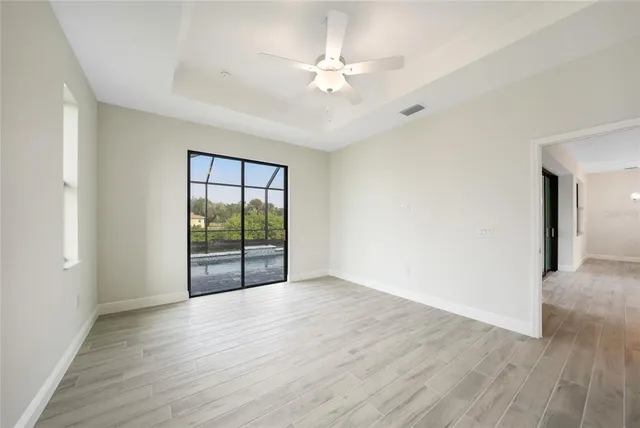 a bathroom with a granite countertop sink a mirror and a shower