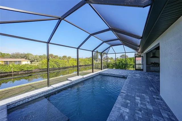 an aerial view of houses with outdoor space