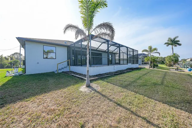 an aerial view of a house with a lake view