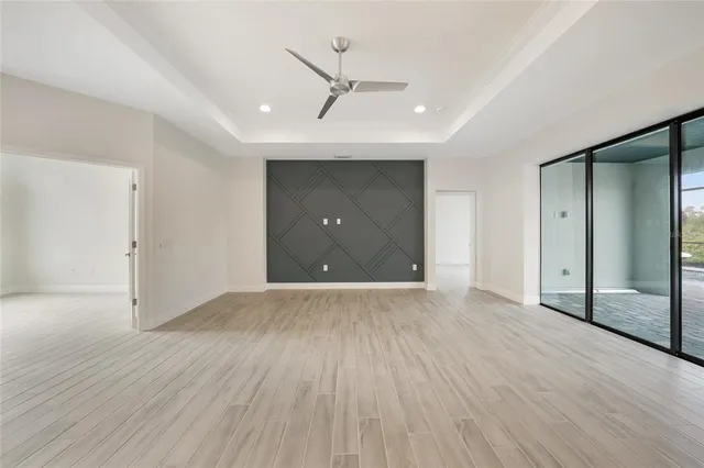 a view of kitchen and kitchen with a sink wooden floor refrigerator