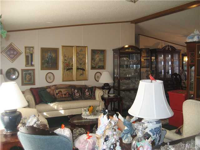 8 Weaver Road Kenly, NC 27542 - Photo 3 of 14 Living Room with cathedral ceiling.