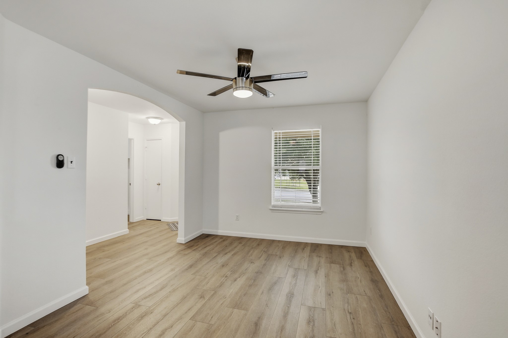 315 Northern Trail Leander, TX 78641 - Photo 11 of 30 wooden floor in an empty room with a window