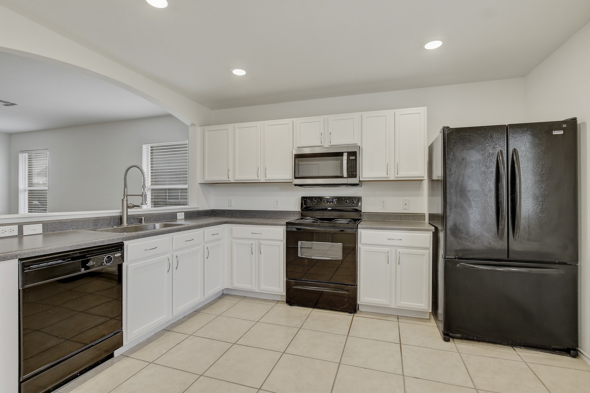 315 Northern Trail Leander, TX 78641 - Photo 14 of 30 a kitchen with a refrigerator stove and sink