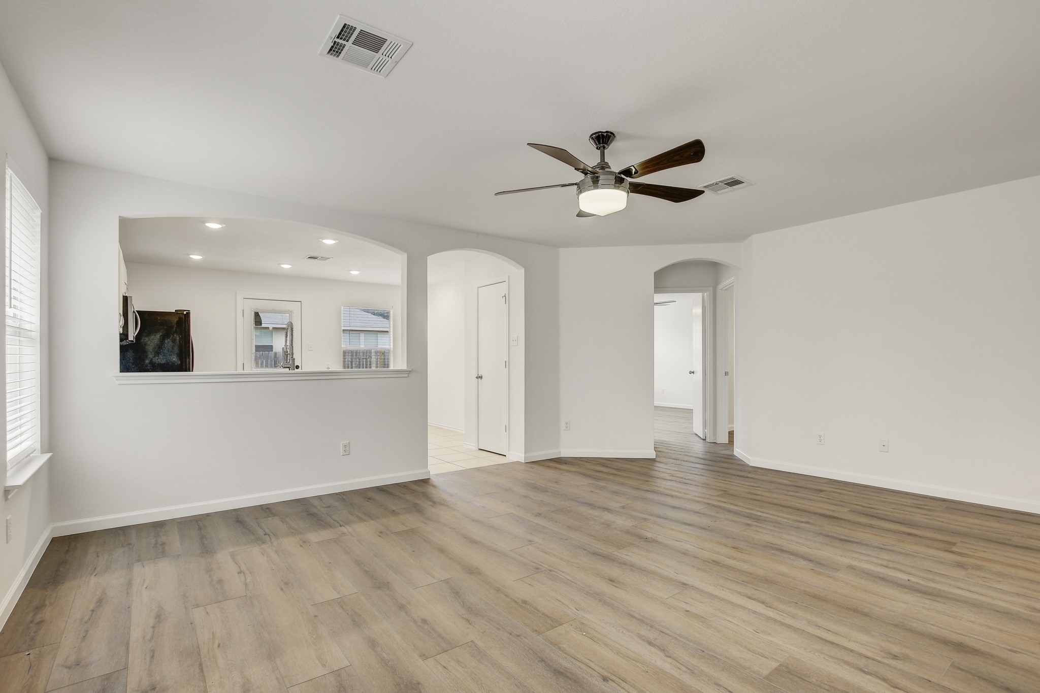 315 Northern Trail Leander, TX 78641 - Photo 8 of 30 wooden floor in an empty room with a window