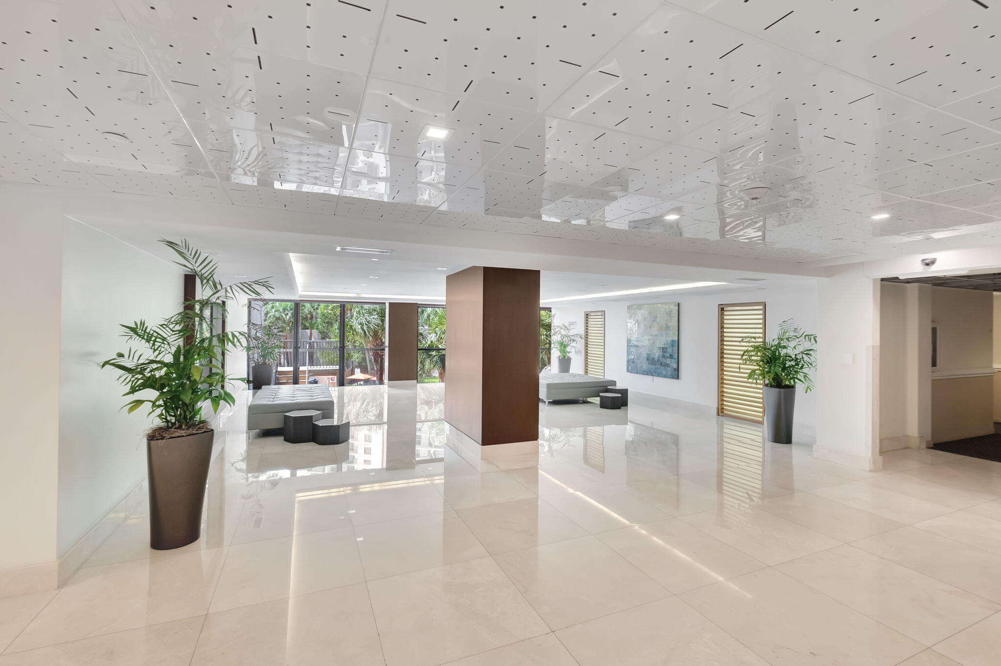 540 Brickell Key Drive, Unit 919 Miami, FL 33131 - Photo 27 of 42 a lobby with furniture and potted plants