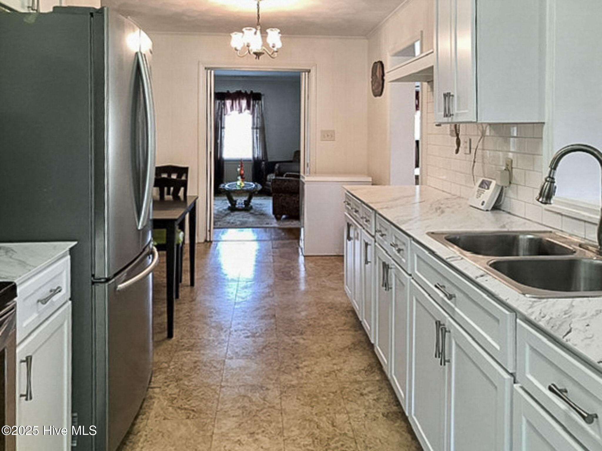 302 Jamestown Road Windsor, NC 27983 - Photo 8 of 23 Kitchen with Updated Cabinetry and Sleek Countertops