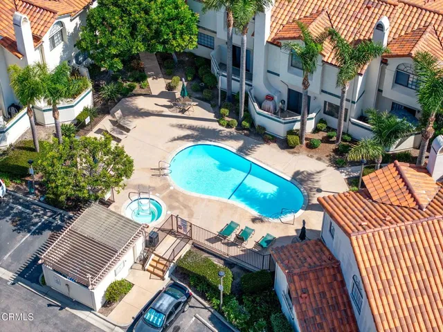 a view of yard from deck with patio