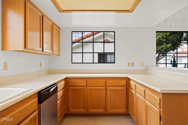 a kitchen with a sink and cabinets